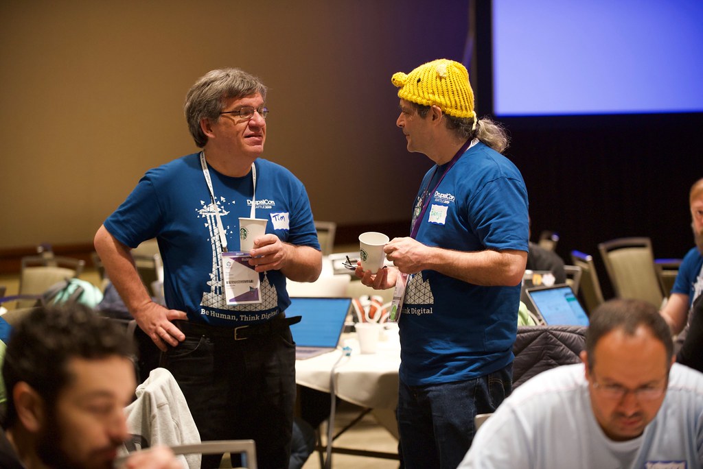 two mentors talking during DrupalCon contribution day, 2019.